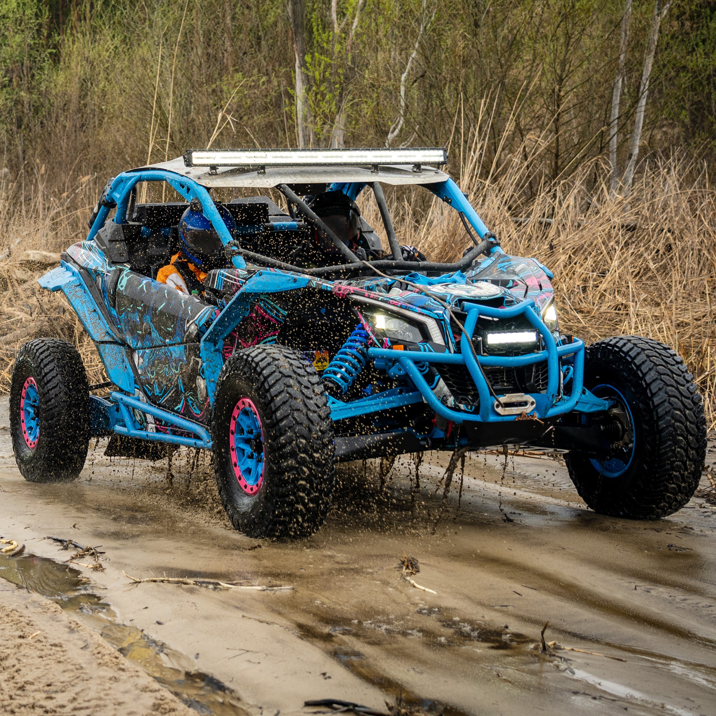 Atv vehicles in muddy water at the quad (buggy) competition